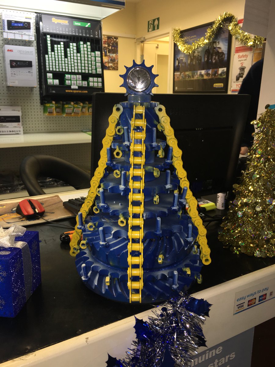 MalpasTractors's tweet photo. Lathom service technician Piotr has been busy in his spare time, creating this fantastic @NHAG_UKandROI-themed alternative Christmas tree! https://t.co/tTYzBFkRq3
