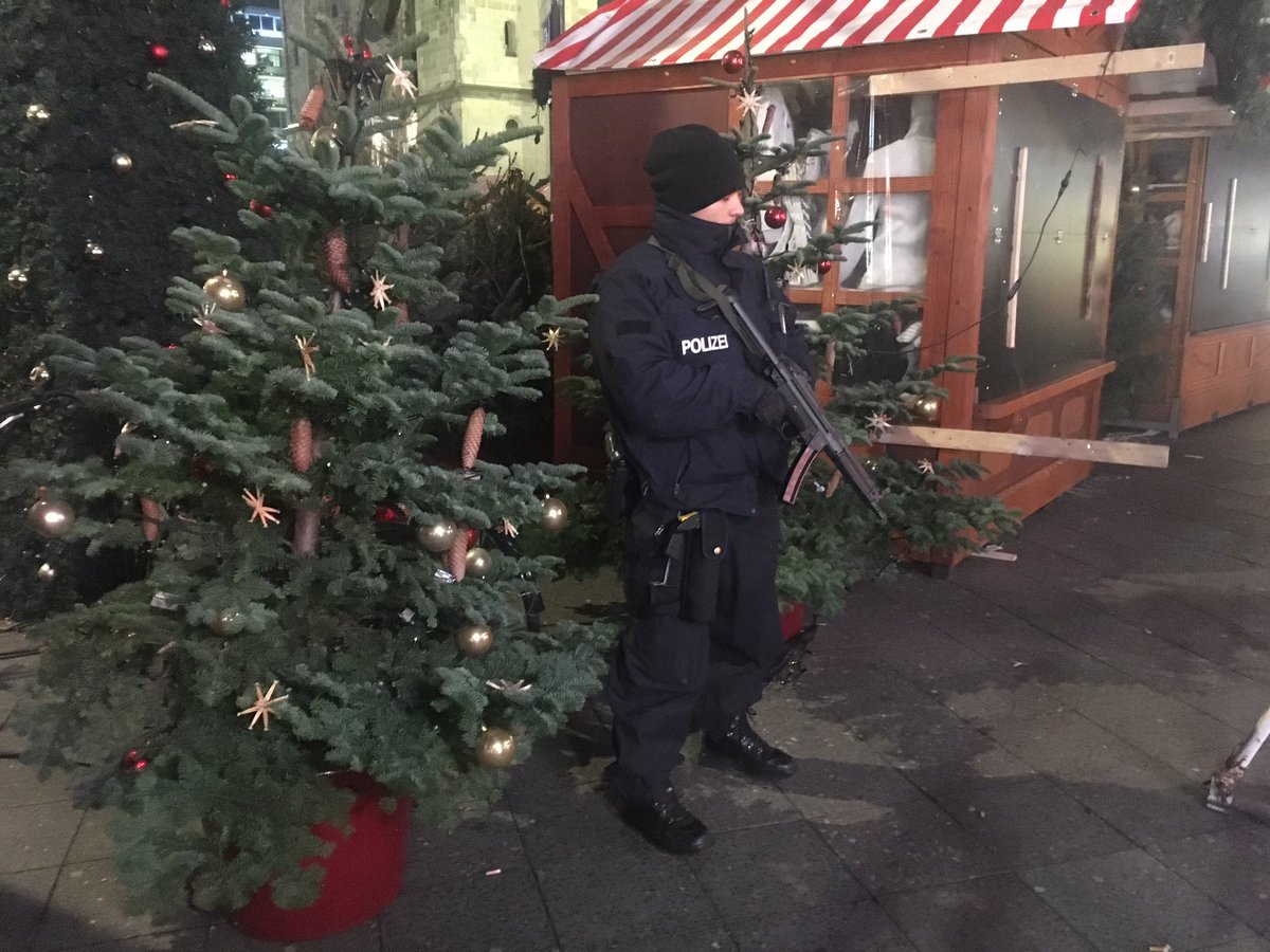 richardgaisford's tweet photo. "Love for all, hate for none". Strong message from #Berlin's Muslim community at tonight's' vigil in closed Christmas market #BerlinAttack https://t.co/EtGhP2JA2J