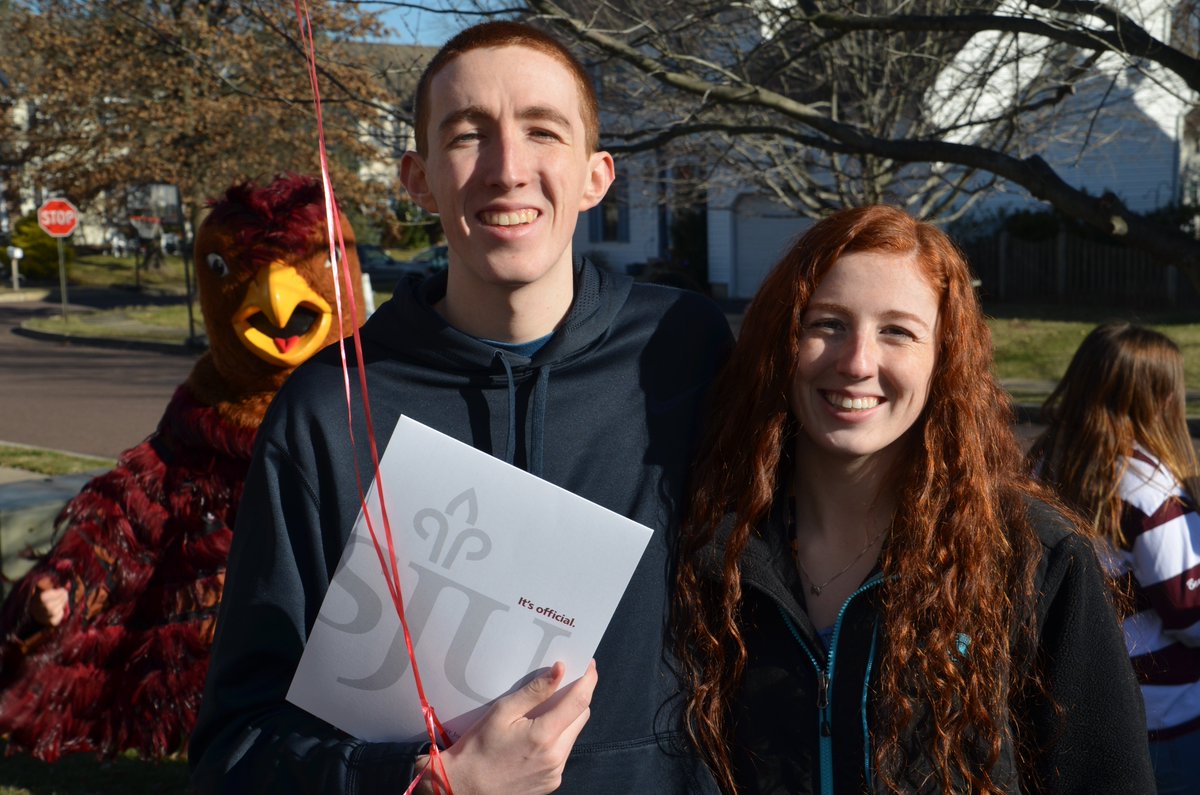 SpringFordASD's tweet photo. That time the @saintjosephs Hawk surprised you at home, gave you your acceptance letter then photobombed your family picture. #RedEnvelope https://t.co/dXFeZXy81K