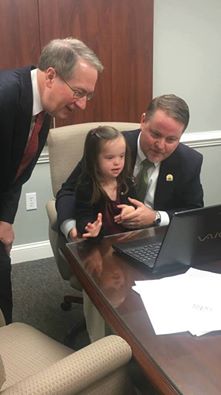 NDSS's tweet photo. @RepGoodlatte helps Madison open her ABLE account!! What a great photo! Thank you Congressman! #advocacymatters https://t.co/8ax0NTApe2