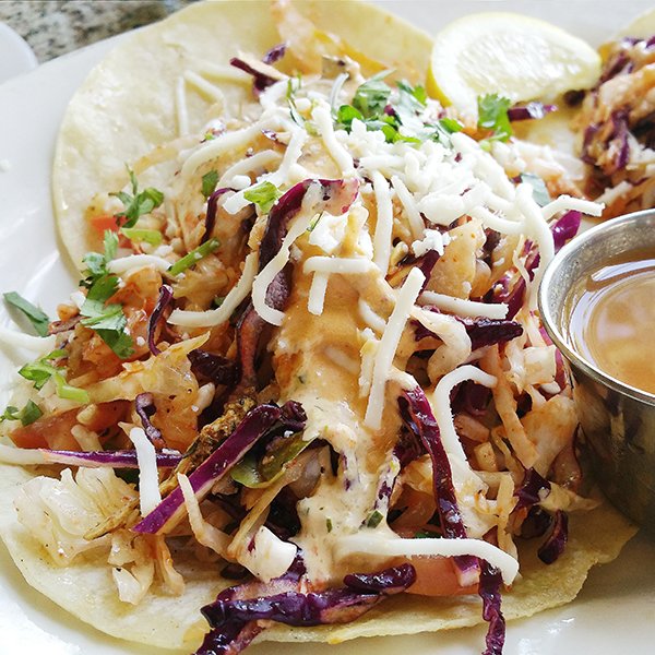 It's #TacoTuesday and we're in love. Meet Mr. Right Now, our Spicy Fish Taco dressed in herb aioli, queso fresco and peach chipotle sauce. 🌮