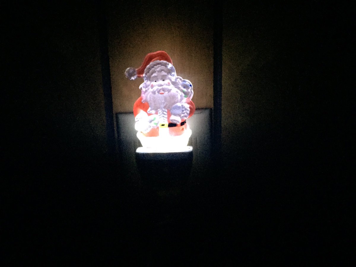 cwe1193's tweet photo. "He sees you when you're sleeping, he knows when you're awake" really does hold true for the Santa night light in my bedroom. #Santapower https://t.co/C3nHpj07SK