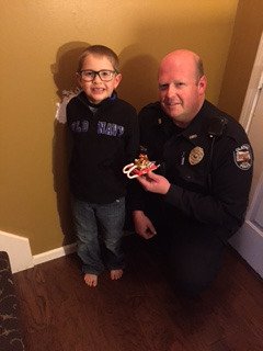 OlathePolice's tweet photo. What do you do when you have a present for the police? This little guy called 911. #foremergenciesonly #butweappreciatethegesture https://t.co/tYB5k1jW6J