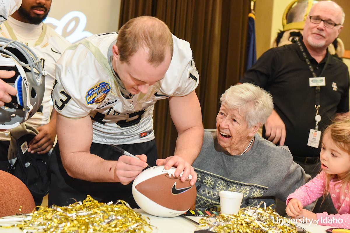 uidaho's tweet photo. The @VandalFootball team  surprised Peg McGee, senior Trent Cowan’s grandmother, this a.m. during a Vandal Spirit Day @ Meridian. #GoVandals https://t.co/HHD7VqpX7O