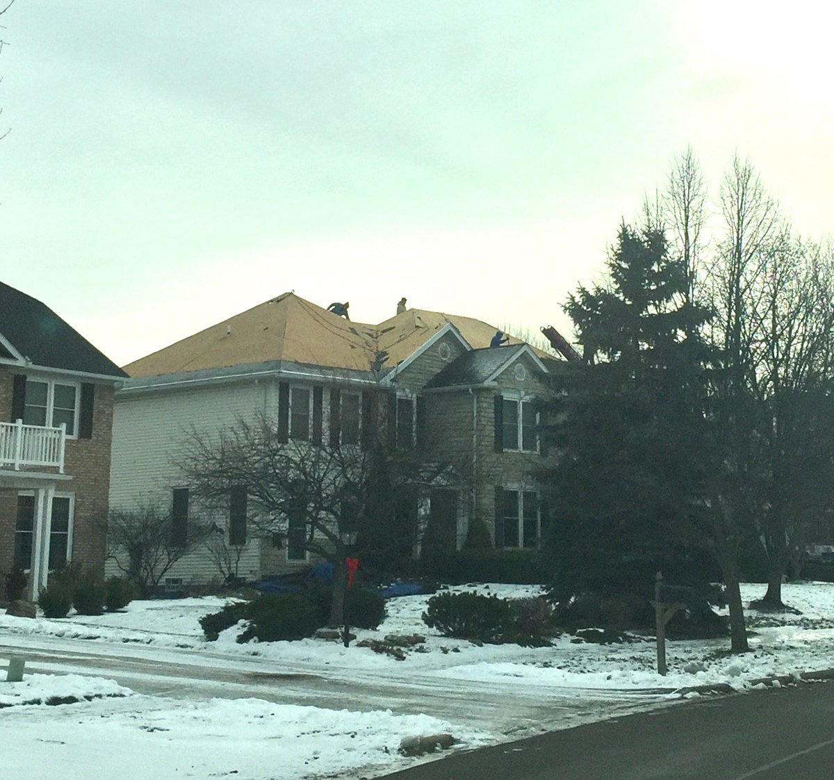 Neither snow nor rain nor heat nor gloom of night stays these roofers from the swift completion of their projects! Dave A's roof in progress