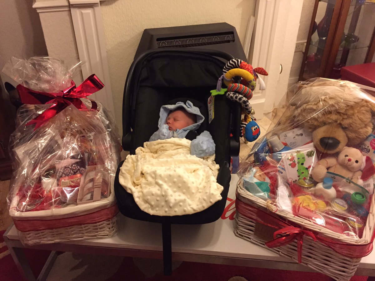WalesHSC's tweet photo. Baby Jacob (and his mum) say thank you for their Christmas hampers - well he would if he hadn't slept through getting them! #Hamperwinners https://t.co/524jOWG3aZ