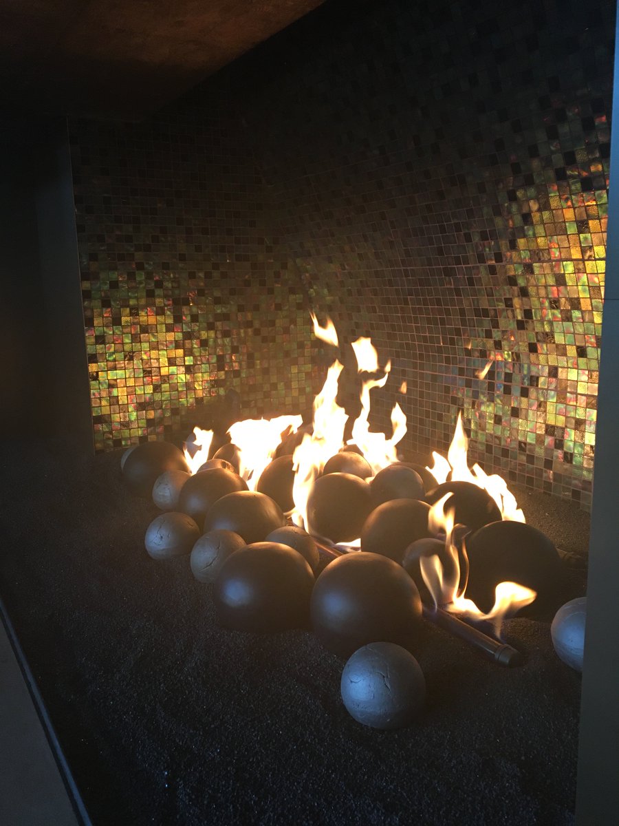 Tis the season to warm up by a cozy fire and enjoy time with friends and family #HappyHolidays #Sonoran #Fireplace