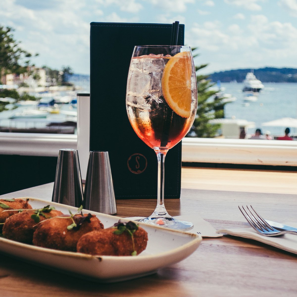 GarfishSeafood's tweet photo. Lunch with a view? Come and join us on the deck at SuGarfish (inside Garfish Manly). Smoked hapuka and pancetta croquettes. #manlylocal https://t.co/NFyxqJt4iX