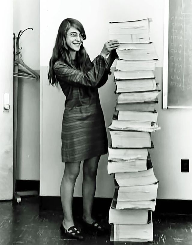 Margaret Hamilton, lead #software engineer of the Apollo Project, stands next to the #code she wrote to take humanity to the moon. (1969)