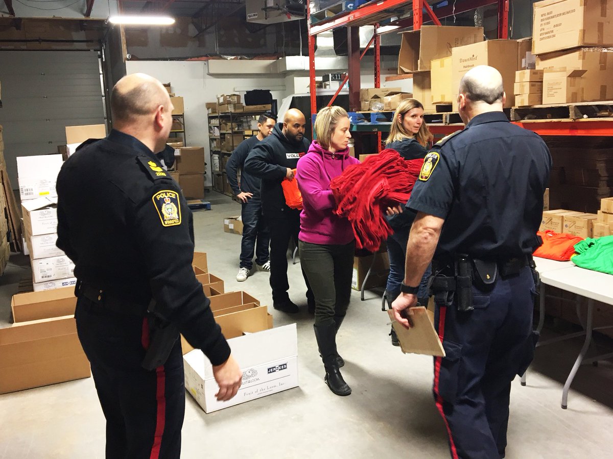 UrbanTactical_'s tweet photo. The team is hard at work this morning separating t-shirts and socks into boxes to sent out to schools in Winnipeg and the surrounding areas. https://t.co/isCUGYgDiY