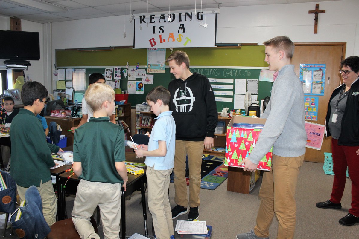 RegisCatholic's tweet image. The sophomore class at #RegisHS made cookies for students at our elementary schools as a Christmas service project!