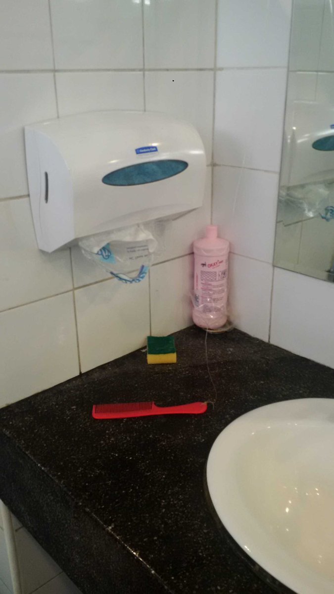 ramanjr's tweet photo. Angkor ticket booth bathrooms feature a comb, tethered to the wall. #thinkingofeverything https://t.co/IVZIPokhTd