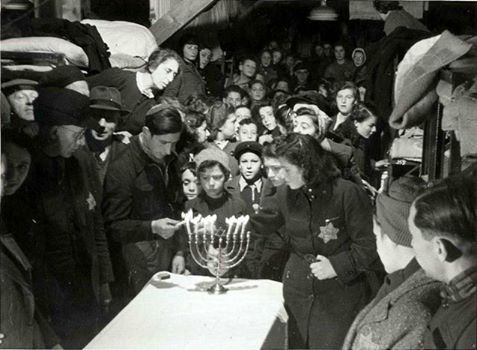 Jews lighting up #Hanukkah candles in a concentration camp in 1943. The Jewish spirit never extinguished!