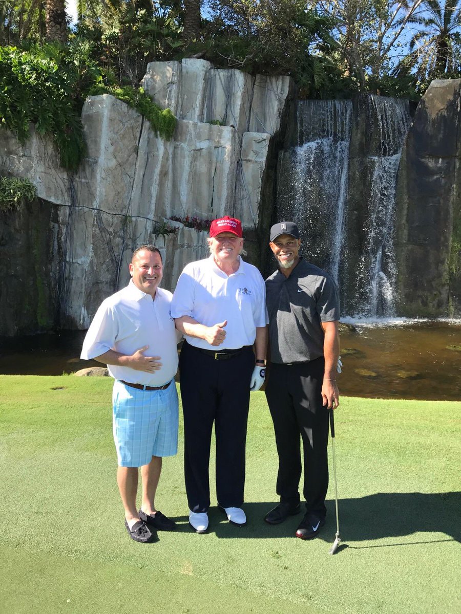 golfweek's tweet photo. Tiger sporting the "Mac Daddy Santa" goatee while playing golf with Donald Trump. 😳

(via @izzy_pecoraro) https://t.co/kVYoJ4yF1w https://t.co/XmWtntY3ee