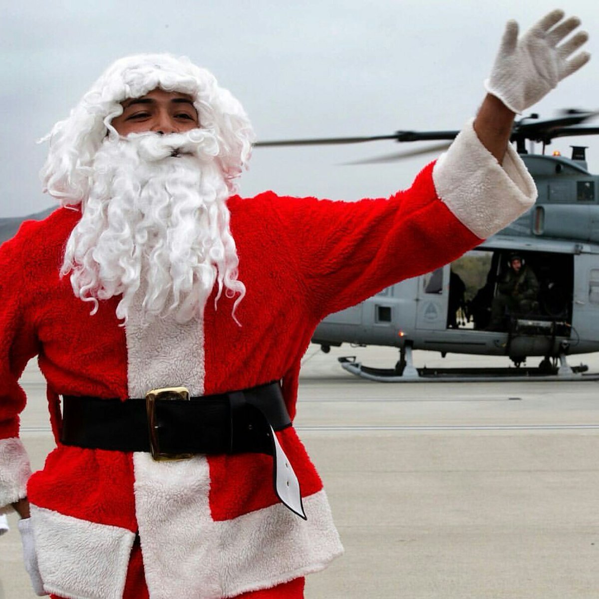 FoCoMarines1's tweet photo. Santa spreading Christmas cheer from a Huey https://t.co/nsea8dyZF8