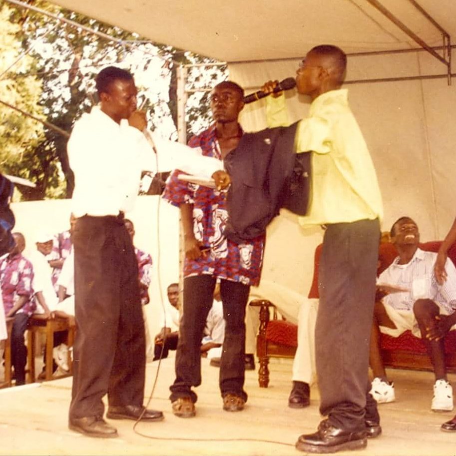 funnyfacegh's tweet photo. Year 2000. Stage play !! With my senior Micheal  Tagoe n my class mate Clifford.. Nyame Ay3 bi oo.. See cambooo and long neck!! #MrHappiness https://t.co/jqJmzYtU37
