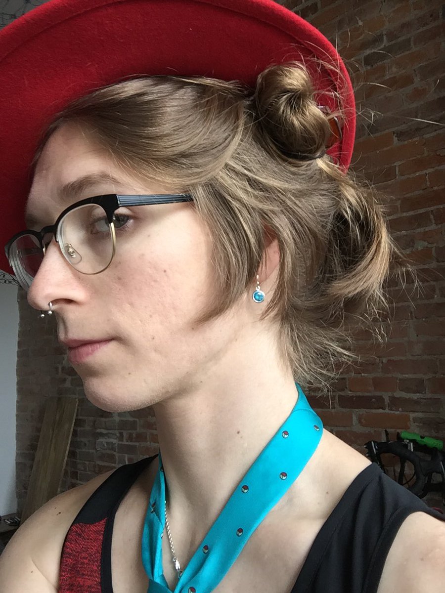 Emma with a dashing red hat and neck tie