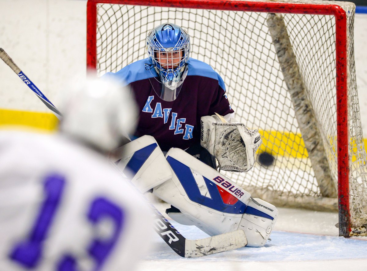AMPhotoNYC's tweet photo. Got to catch some hockey in the #CHSHL. Here's one of Xavier goaltender Luke Erhard as a St. @stedmundprep attacker fires a shot on net. https://t.co/14YhTJ4E8M