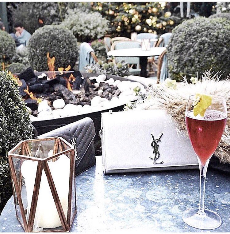 Enjoy a cocktail in our winter garden and keep warm by the fire pit #wintergarden #Chelsea #kingsroad #firepit