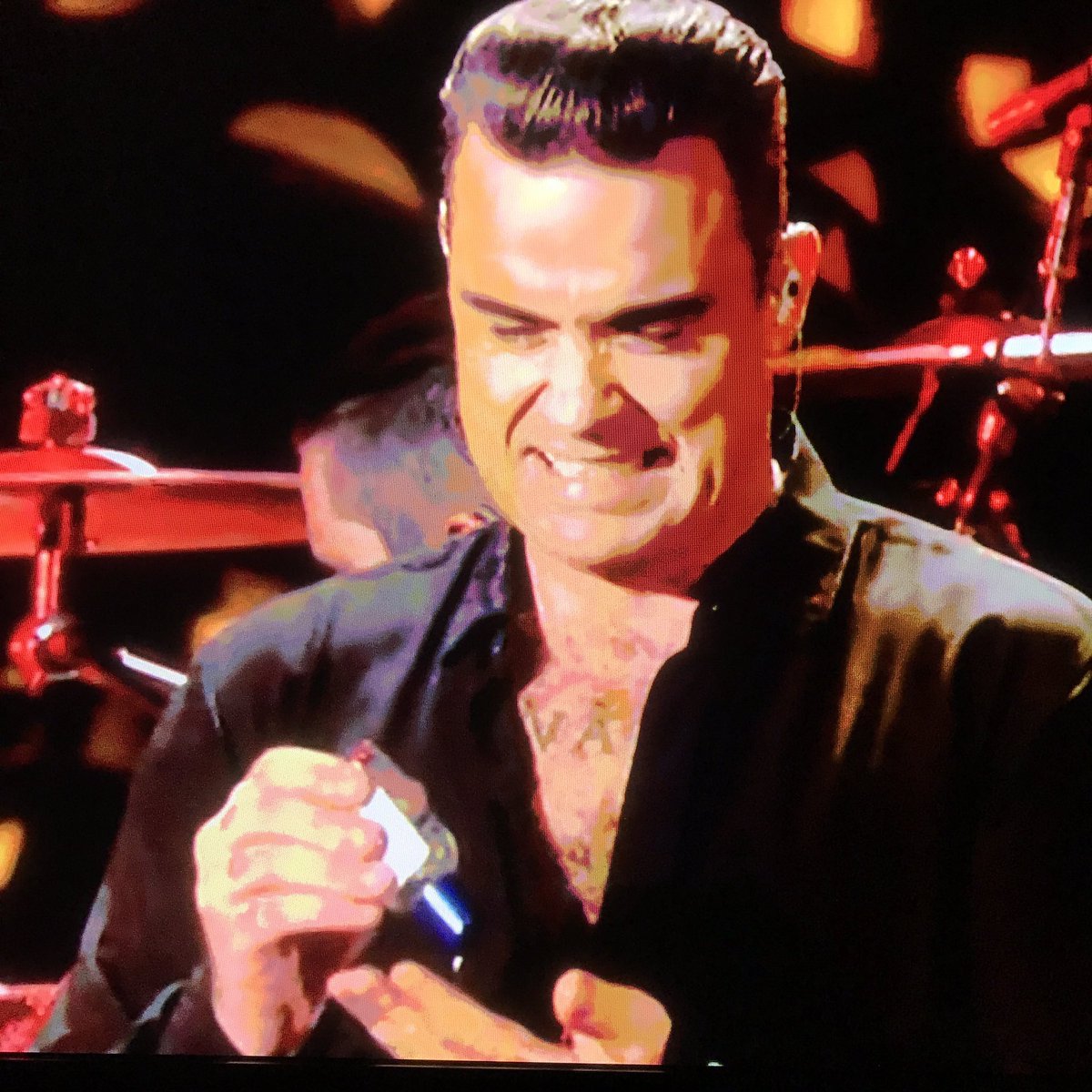 MrLukeJohnston's tweet photo. Robbie Williams pulling out the hand gel after doing Auld Lang Syne with the public has been my highlight of 2017 so far. https://t.co/b04DDpSVex
