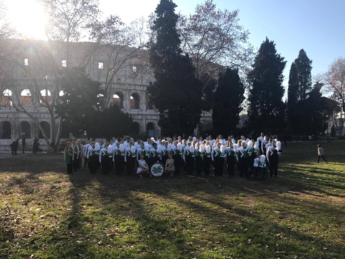 .@MarshallBands in front of the Coliseum in Rome!! They will step off in the New Year's Parade at 9:30 EST. Photo: @adamfdalton.