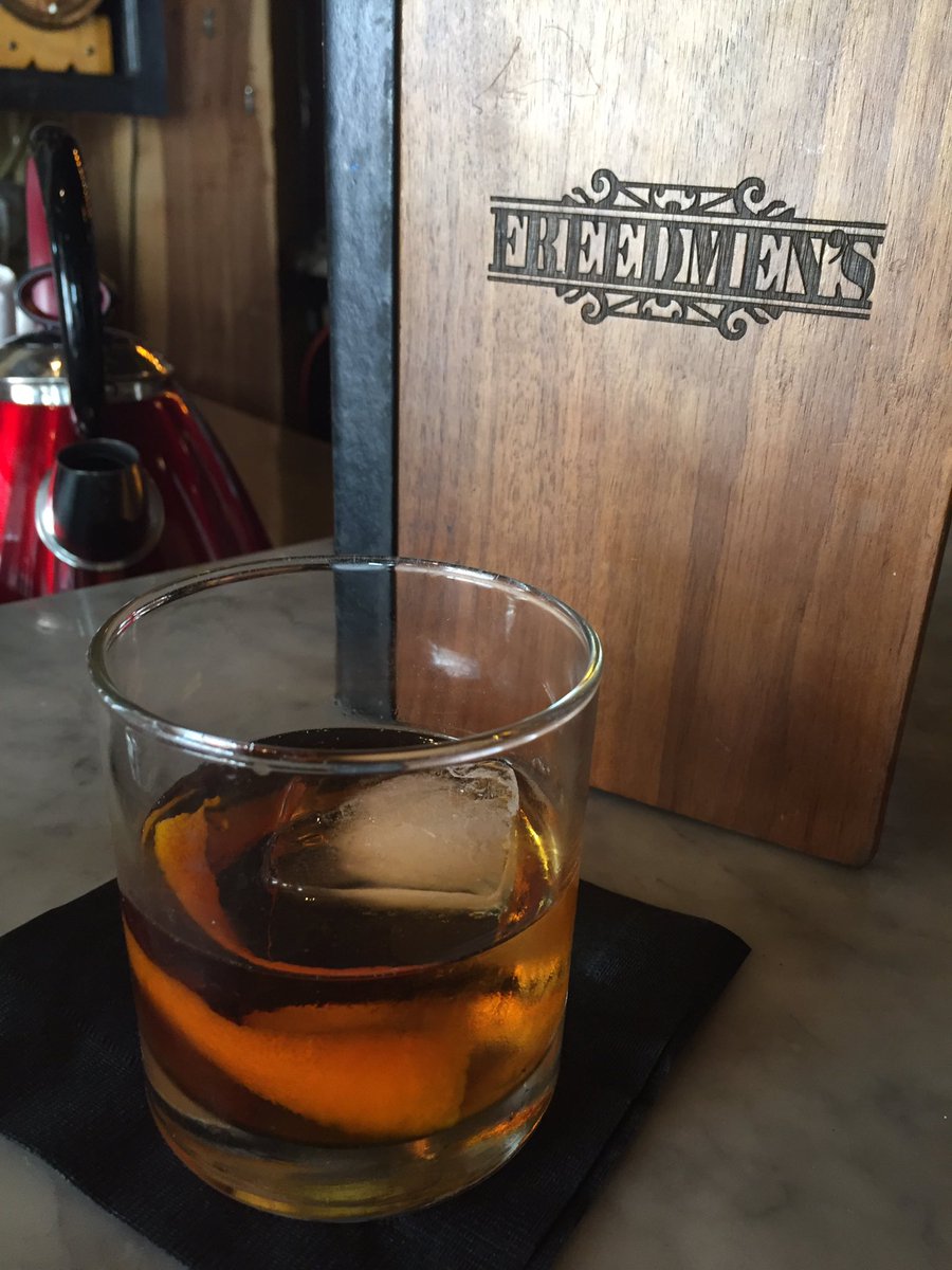 Starting the year with a classic Manhattan and smoked brisket, because it's 70 degrees and sunny in #ATX | <a href="/FreedmensBar/">Freedmen's</a>