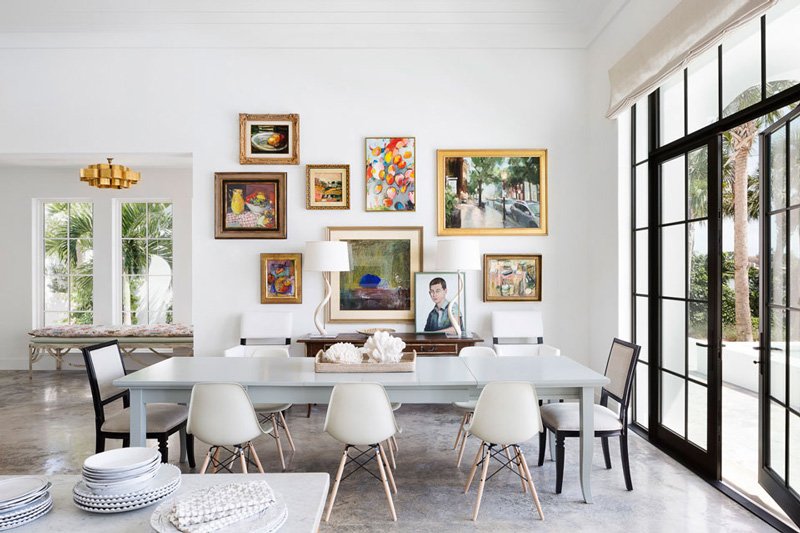 #Whitewalls juxtaposed with original colorful #paintings exude #sophistication in this airy dining space. Design: #oliviaobryaninc