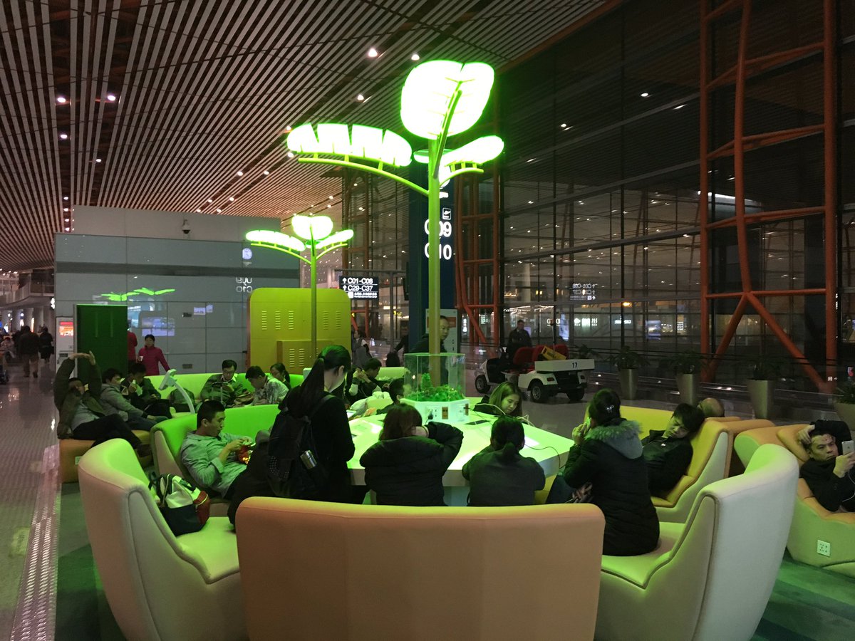 BenRoss's tweet image. Humans, draining life sustenance at an airport charging kiosk #Beijing.