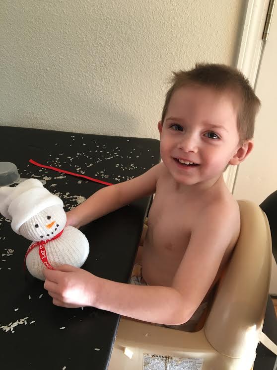 CapableKidsNFam's tweet photo. Rice+a sock+a ribbon = a great sensory activity! Beth "built" a snowman with this little guy today! #sensory https://t.co/wkgjZ3IZzX https://t.co/ZkpMJzdNT9
