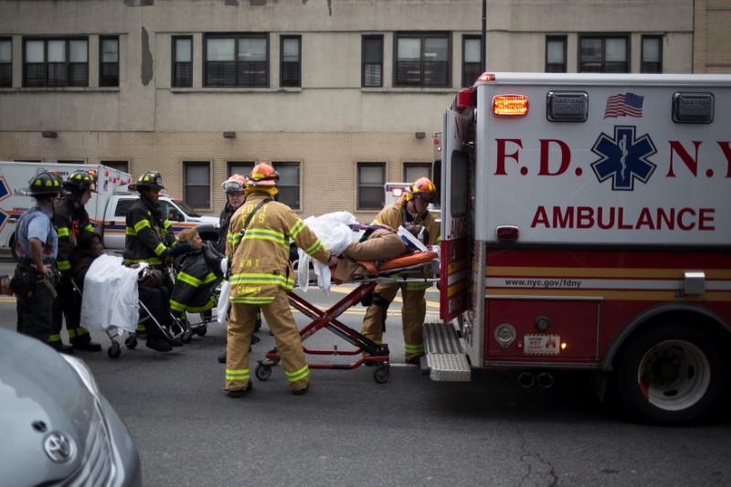 Reuters's tweet photo. New York commuter train derails in Brooklyn, more than 100 injured https://t.co/r3Ko2Pt9EG https://t.co/GJXCYaH744