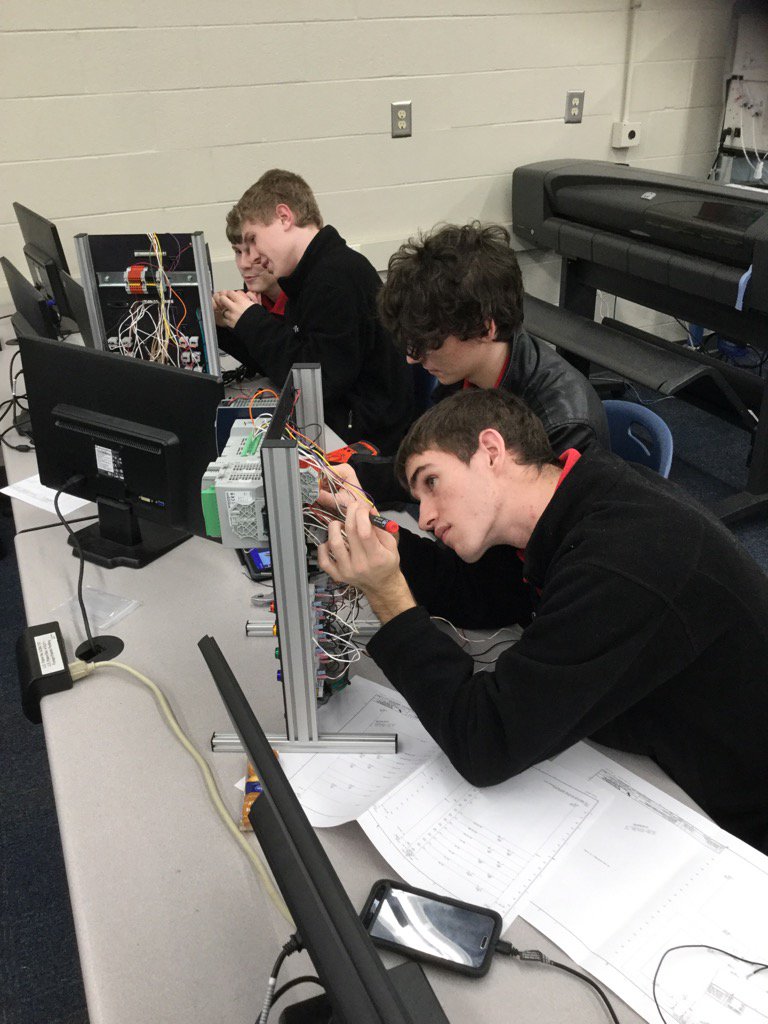 TollesRAMTEC's tweet photo. Tolles Engineering and Manufacturing students wiring Allen Bradley PLCs #lifttolles #myohioclassroom https://t.co/jxHfigng4v