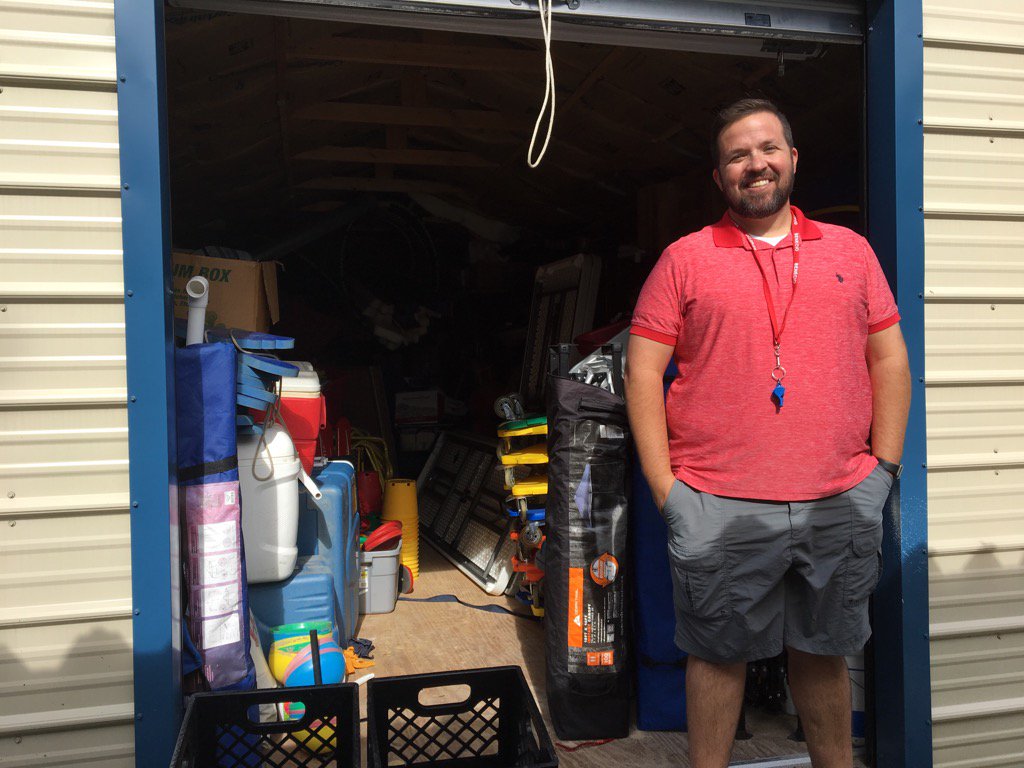 TrangPhamBui's tweet photo. PE teacher Joe Clark stands in front of shed he uses to store school gym equipment. https://t.co/kJSFPcd3sU