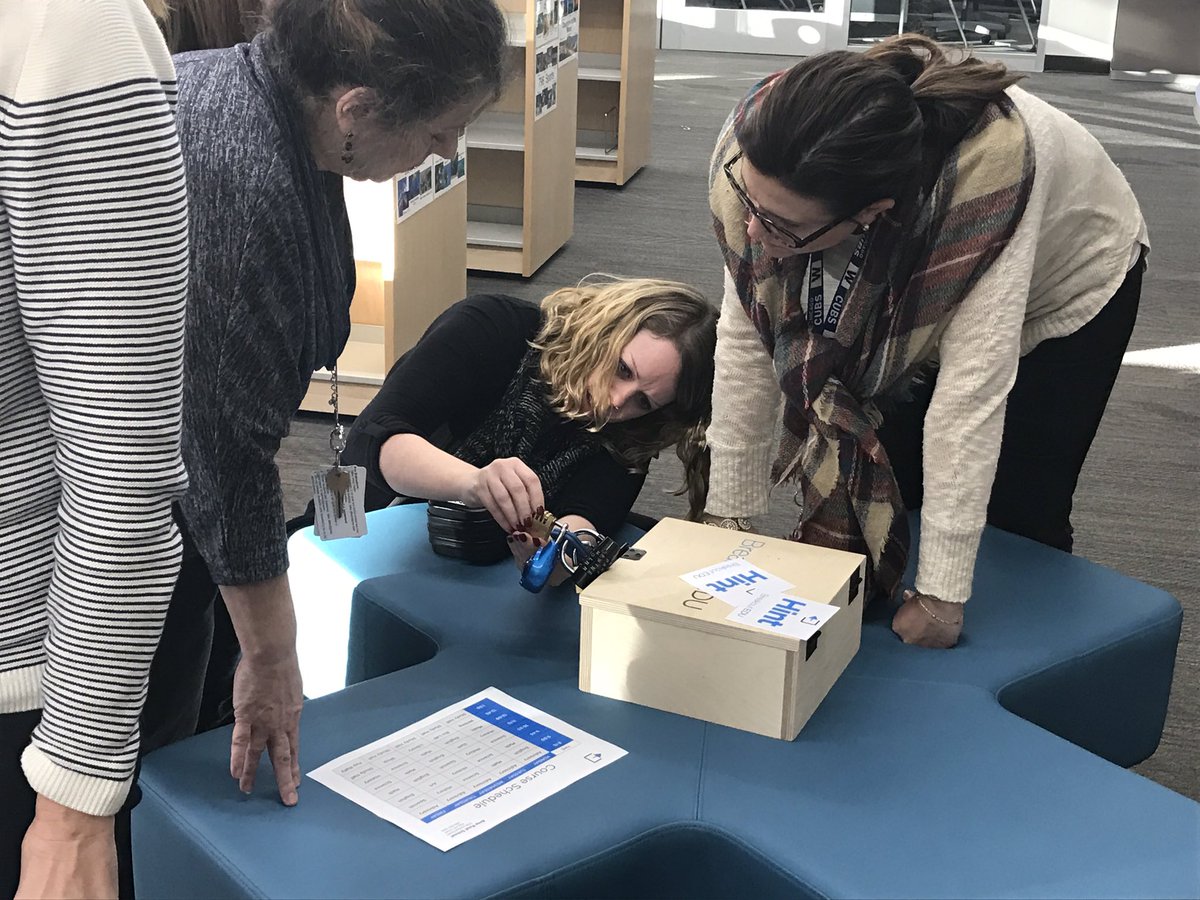 Teachers hard at work trying to breakout!! <a href="/breakoutEDU/">Breakout EDU</a> #wal109