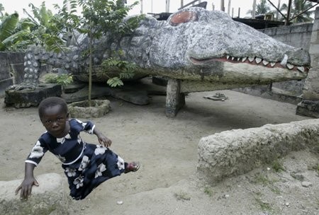 DesignerREstate's tweet image. #Wacky #Wednesday! Crocodile home in the Ivory Coast! Built and lived in by Thierry Atta, this hollowed crocodile even features windows!