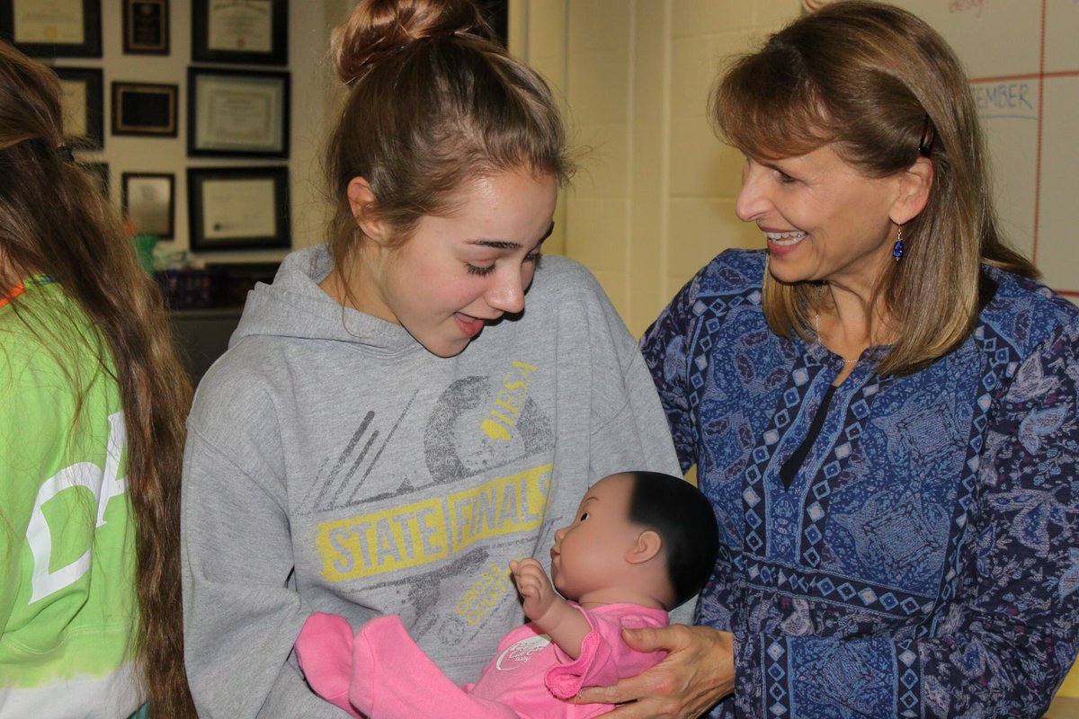 GRANTS IN ACTION
NCWHS' Barbara Bush talks with Mackenzie Allsop about her "baby." A BTBEF grant funded this Infant Simulation Project.