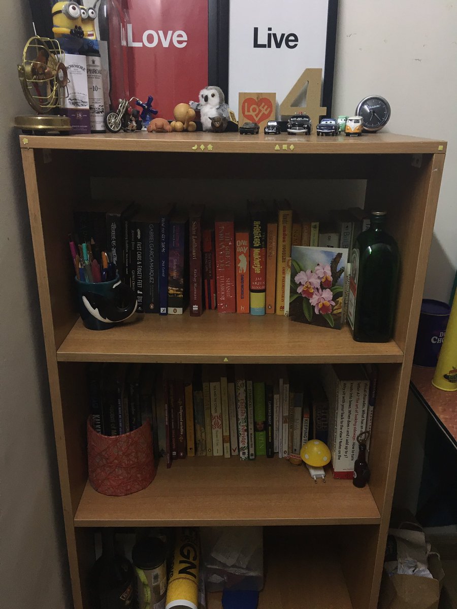 SugunaDew's tweet photo. "When it seems that you don't have a life, go and stand next to your bookshelf." Via @vivekisms :) #ColorCodedBookShelf https://t.co/Gi32WT4ix2