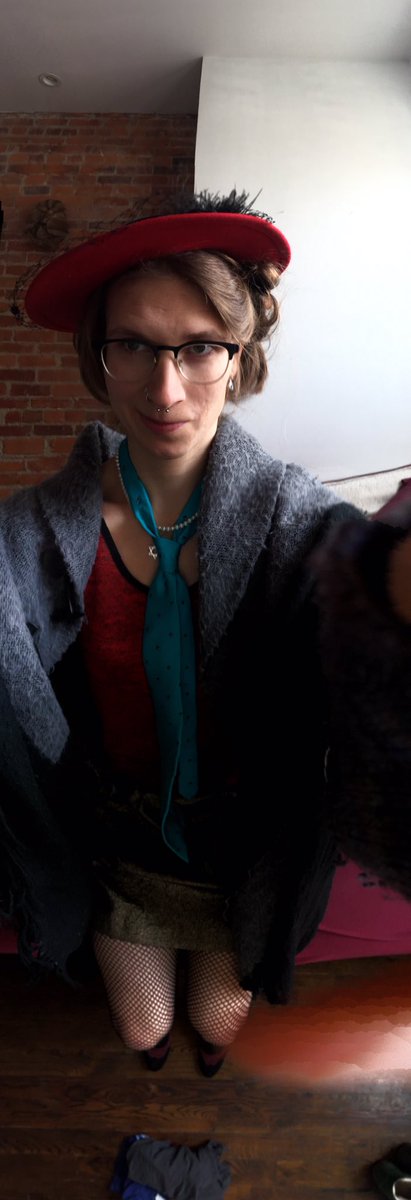 A panoramic selfie of Emma in a good outfit