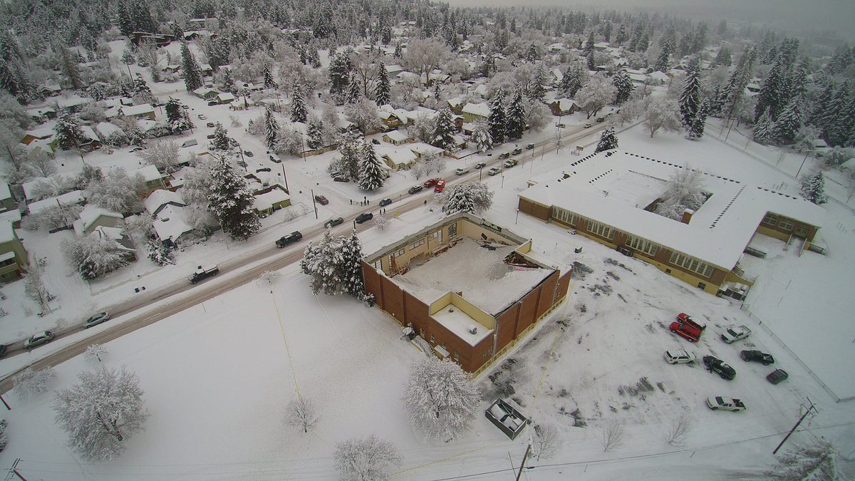 bcsalmon's tweet photo. Dude. So scary. Via @KTVZ: Drone shot shows the Highland Elementary School roof collapse #inBend due to snow load. Photo courtesy: Kyle Low https://t.co/e2s0lWJogT