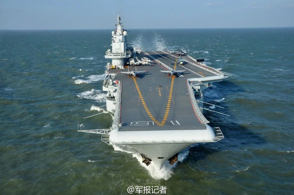 PDChina's tweet photo. Chinese aircraft carrier Liaoning conducts drill in the #SouthChinaSea with J-15 fighter jets https://t.co/yQb3Y1cR39 https://t.co/04DH66ZWsG