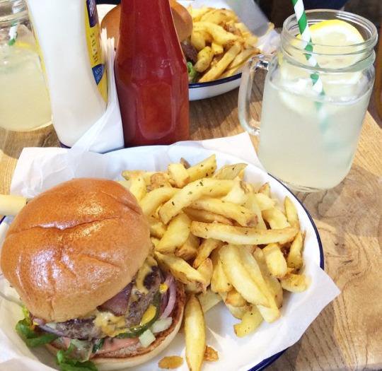 Burger and fries with a cold lemonade