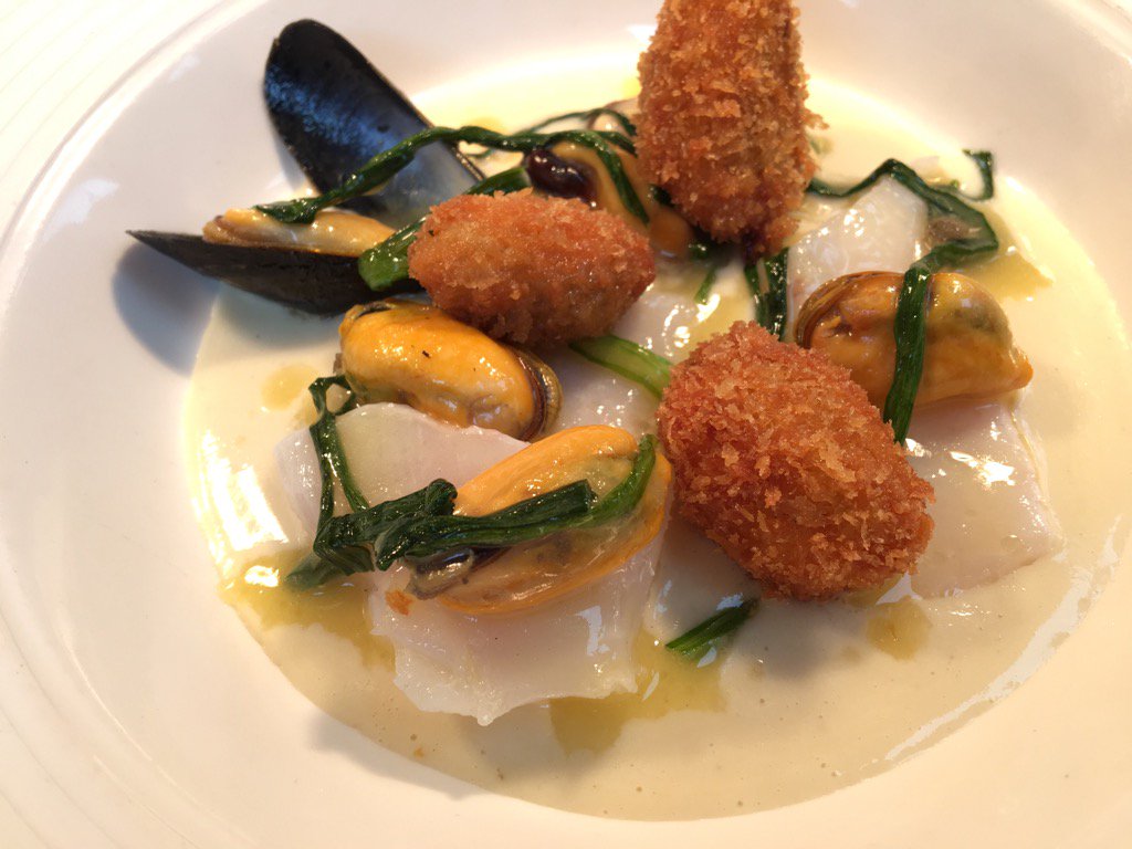 Mussel kievs back with garlic velouté, wild leeks and cod poached in olive oil