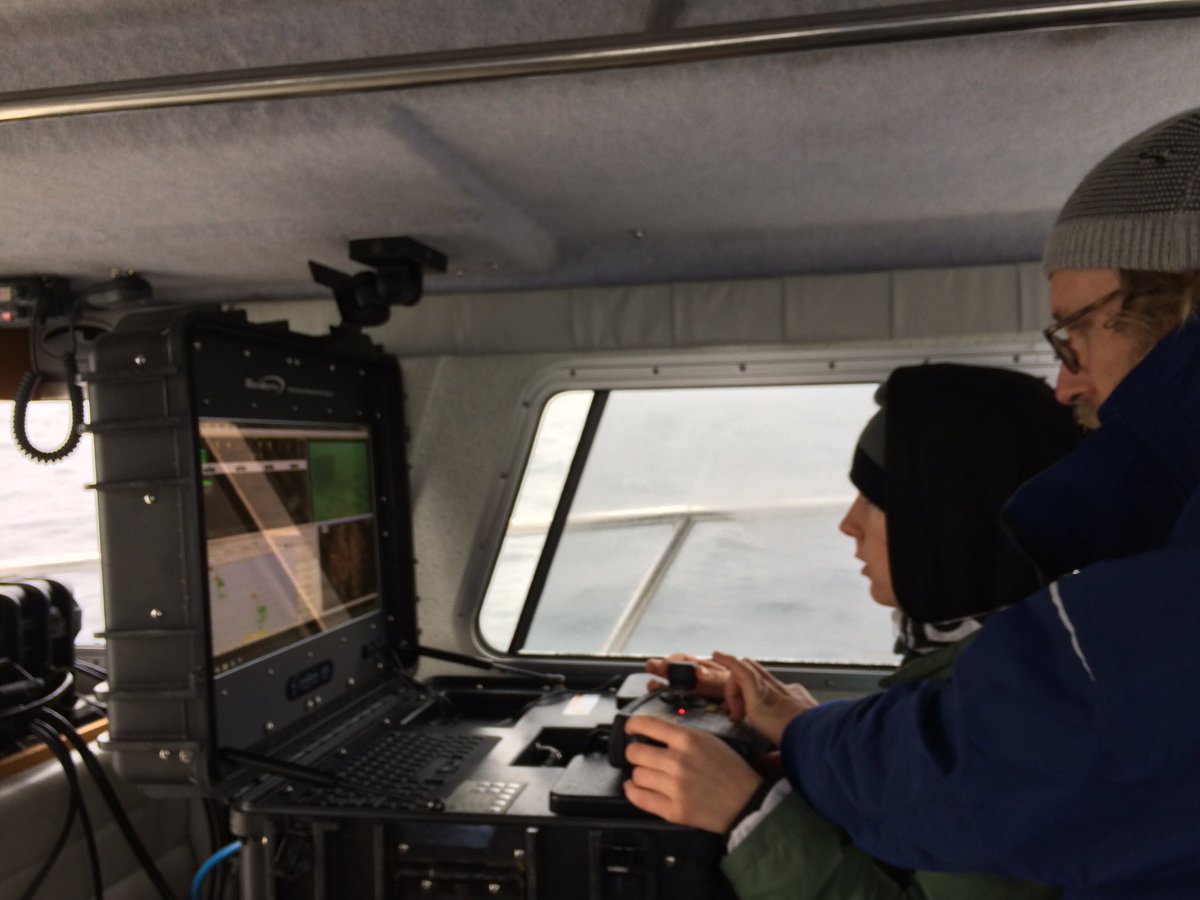 Intern Judith Chadwick gets "stick time" during ROV operations in support of Navy Programs.  Unmanned systems SME Chad Nelson instructs.