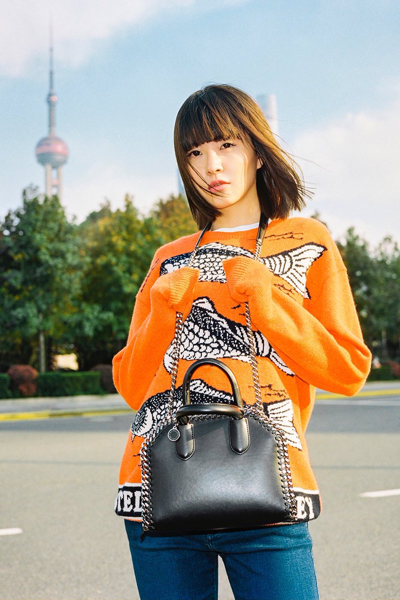StellaMcCartney's tweet photo. Nothing fishy here! Fil Xiaobai on the streets of Shanghai in new season intarsia for our latest #OneCityOneGirl: https://t.co/oMXCkUQKKT https://t.co/T3HQCEJp1Z