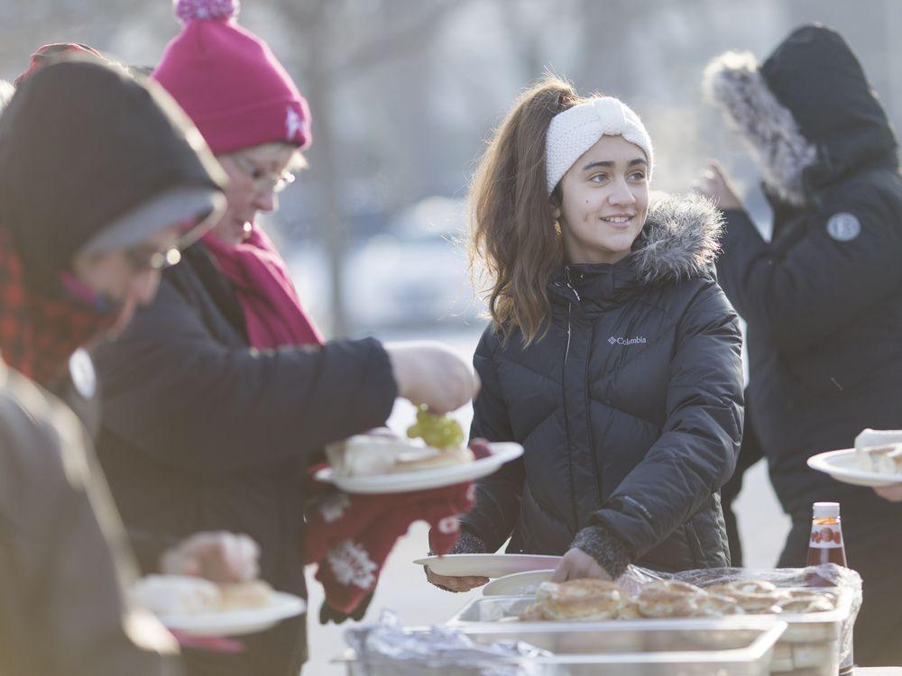 Young activist hands out breakfast to striking library workers windsorstar.com/news/local-new…