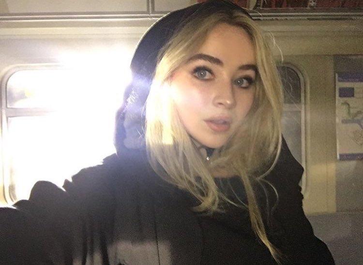 sabrina is over here robbing banks, snatching weaves, and looking expensive while doing it