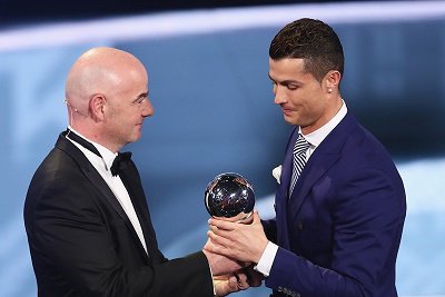 Ronaldo of Portugal/Real Madrid accepts Best FIFA Men's Player Award from FIFA President Infantino during The Best FIFA Football Awards