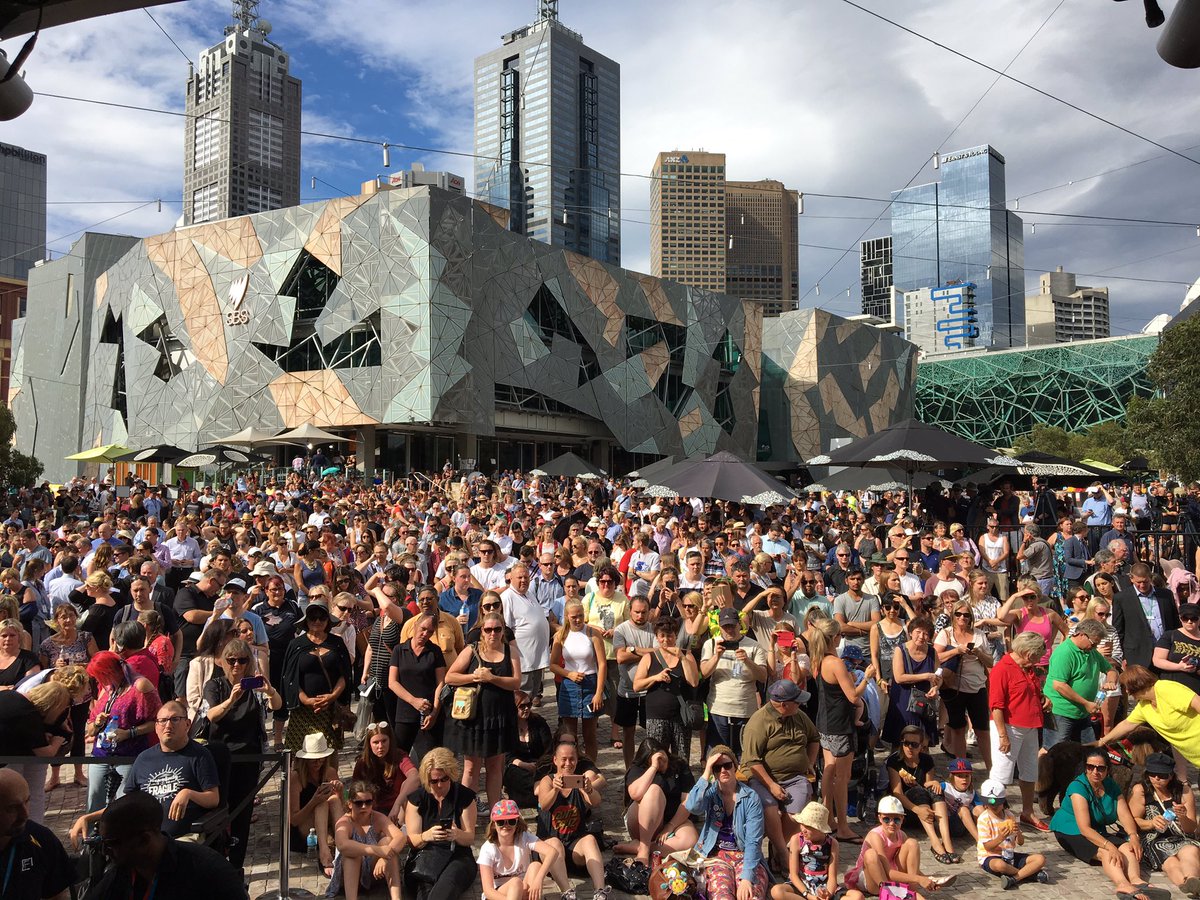 cityofmelbourne's tweet photo. Melburnians have gathered in #FederationSquare to pay tribute to the victims of the #bourkestreet tragedy. #weloveyoumelbourne https://t.co/e0uueabrad