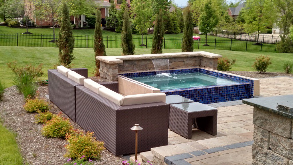 San Juan Fiberglass Pools Margarita spa 9x9 with vanishing edge.