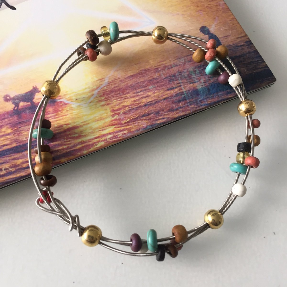 comfort_doll's tweet photo. Custom creation with used @samrobertsband guitar string to match #lofantasy album cover! Want something custom? Tweet us! #charityv https://t.co/leqGCBr0Bk