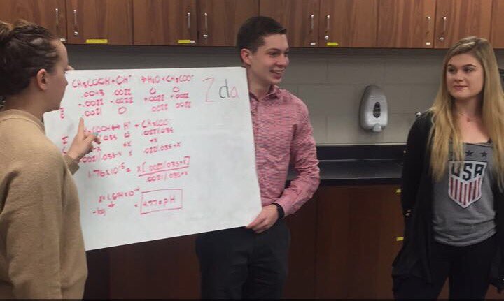tommyjpollack's tweet photo. @CookChemistry students are all smiles after teaching the class a difficult titration problem #nahsbettertogether https://t.co/gKwS2AdAka